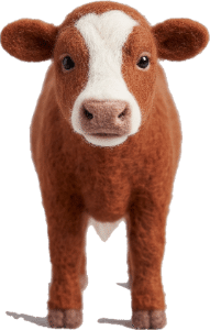 Búkolla, a felt cow, hero of “Búkolla, the Magic Cow”